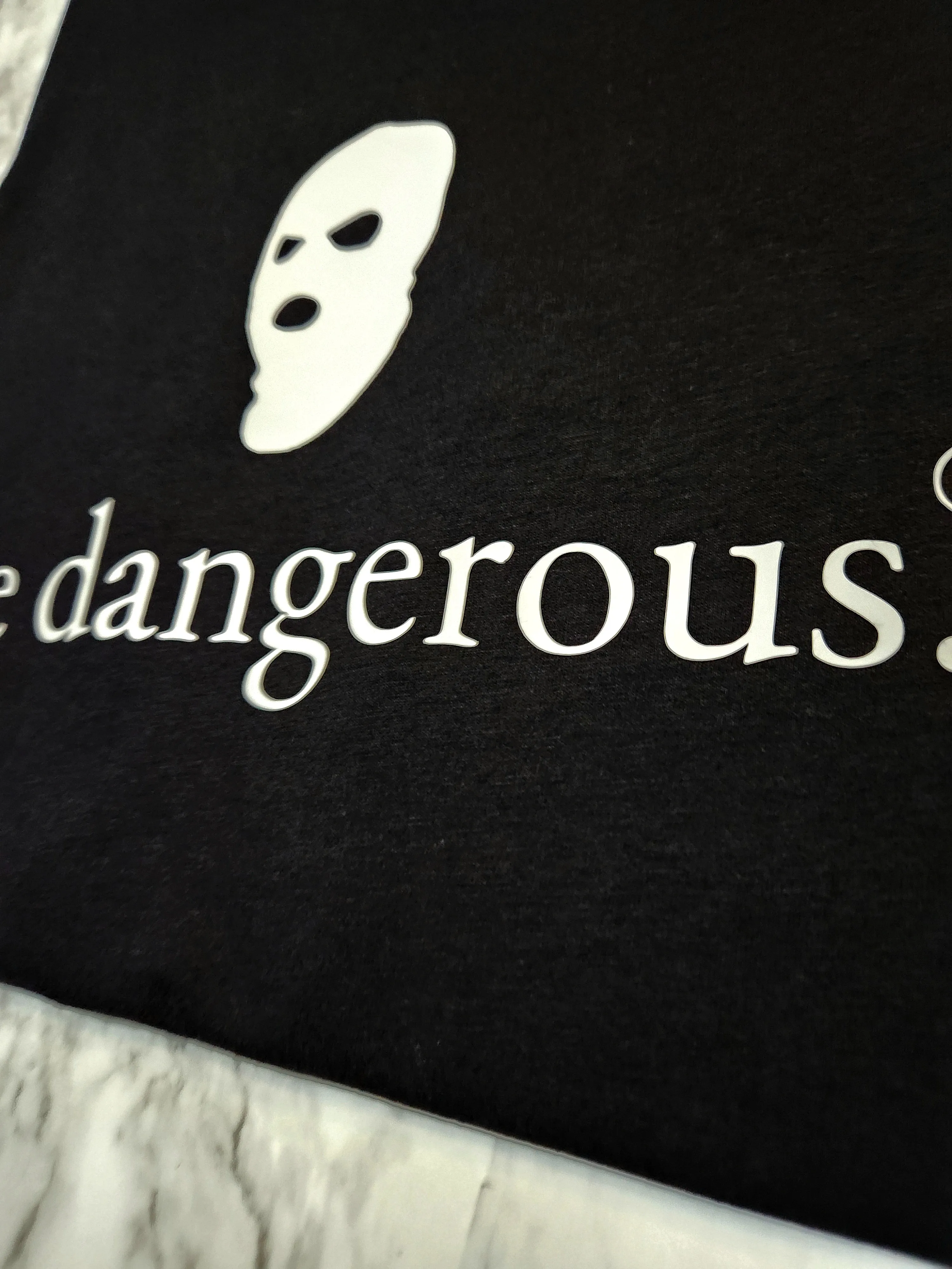 Be dangerous. T-Shirt
