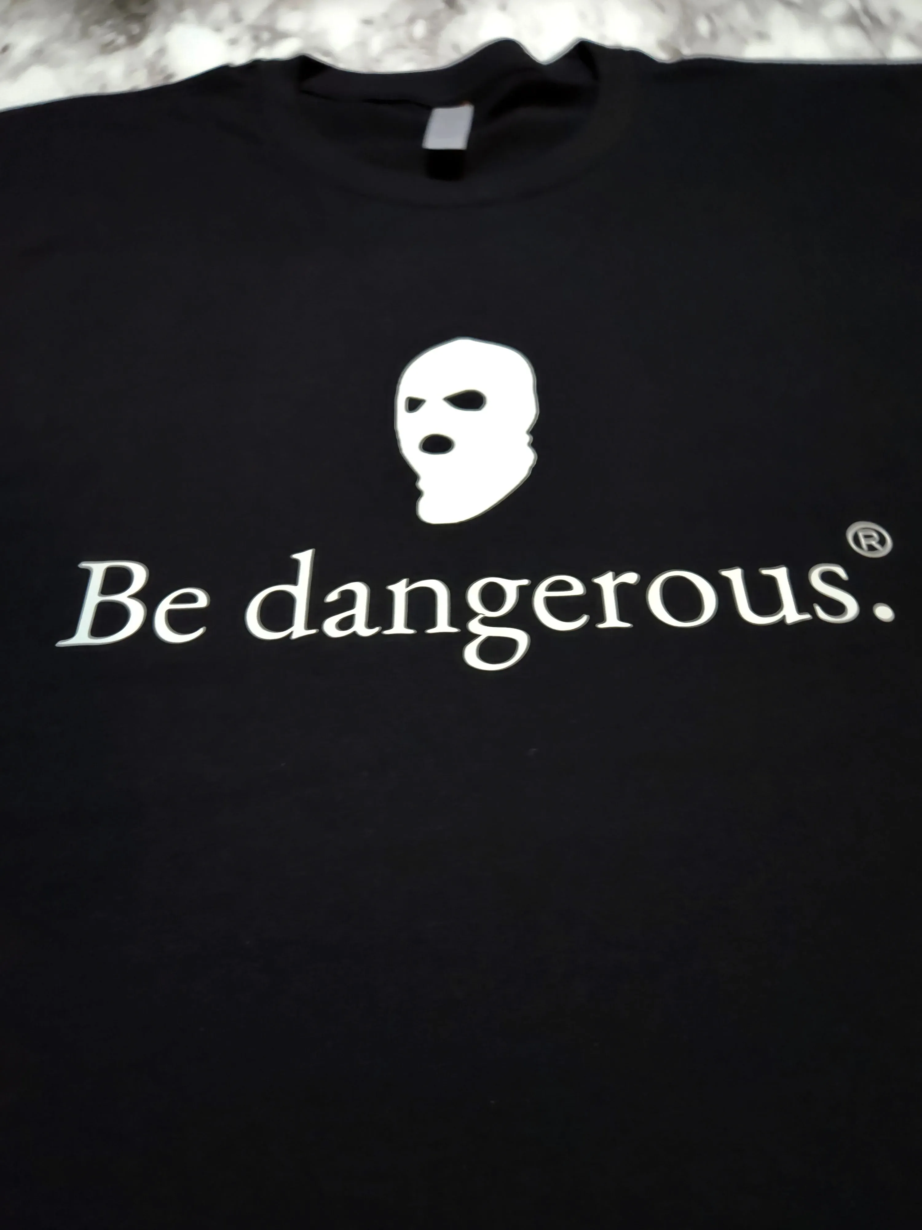 Be dangerous. T-Shirt