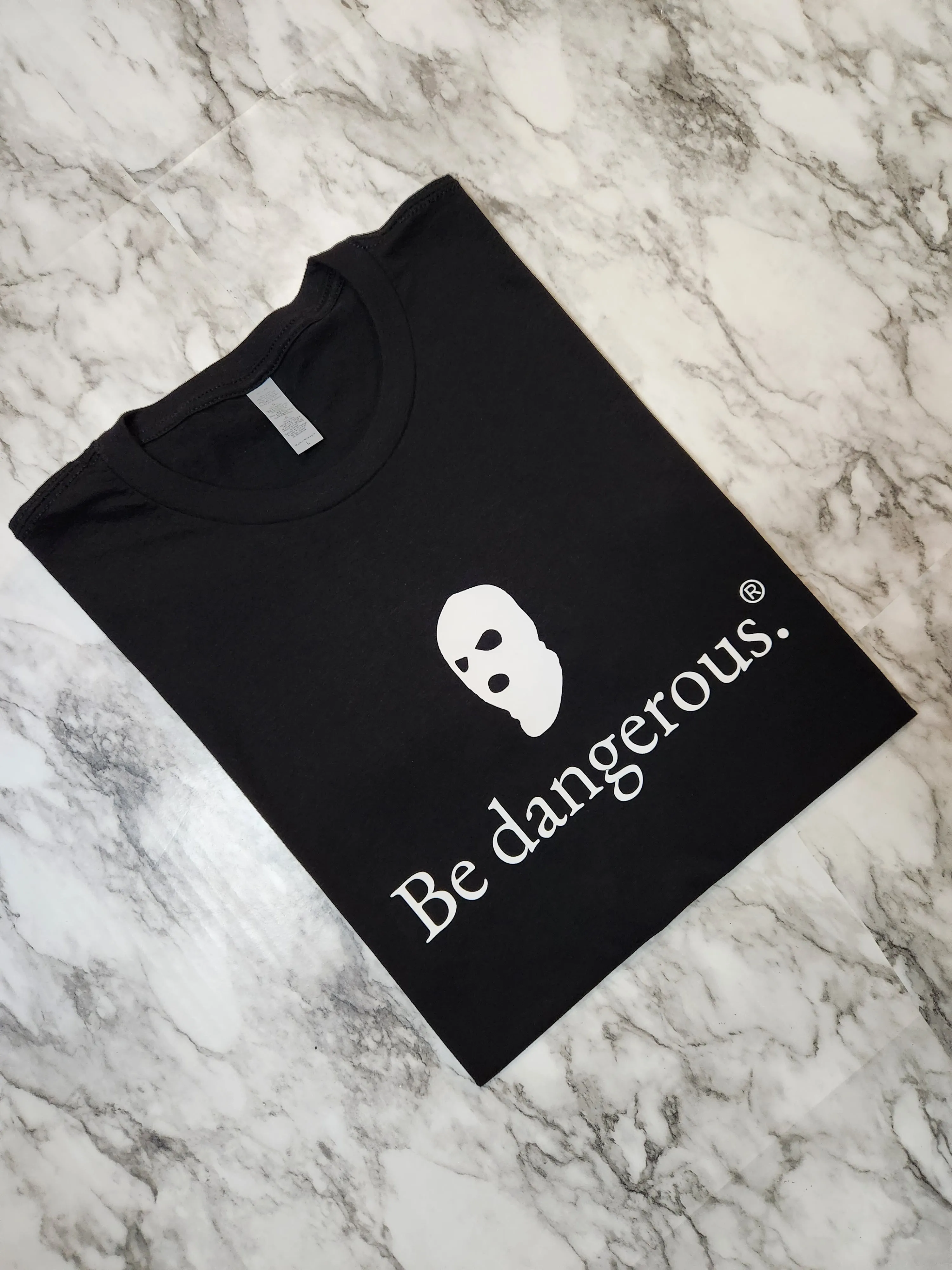 Be dangerous. T-Shirt