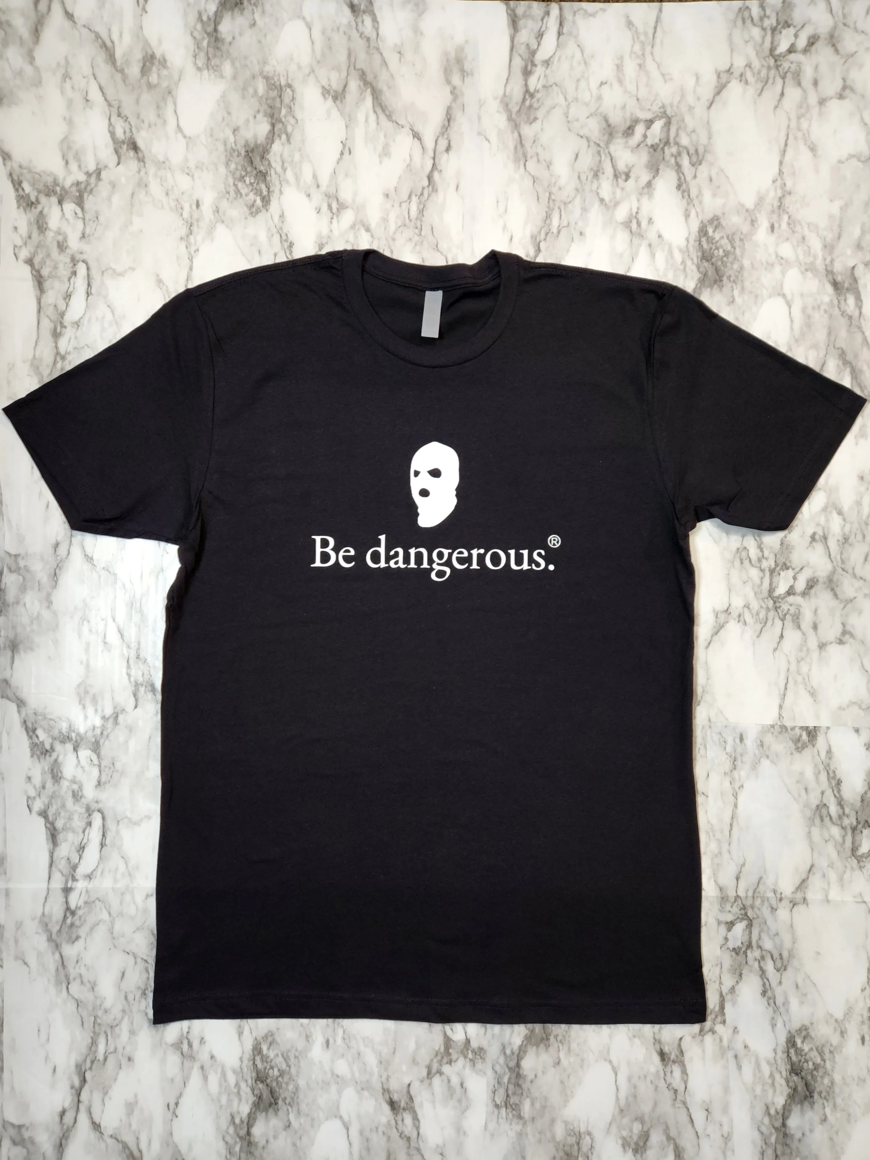 Be dangerous. T-Shirt
