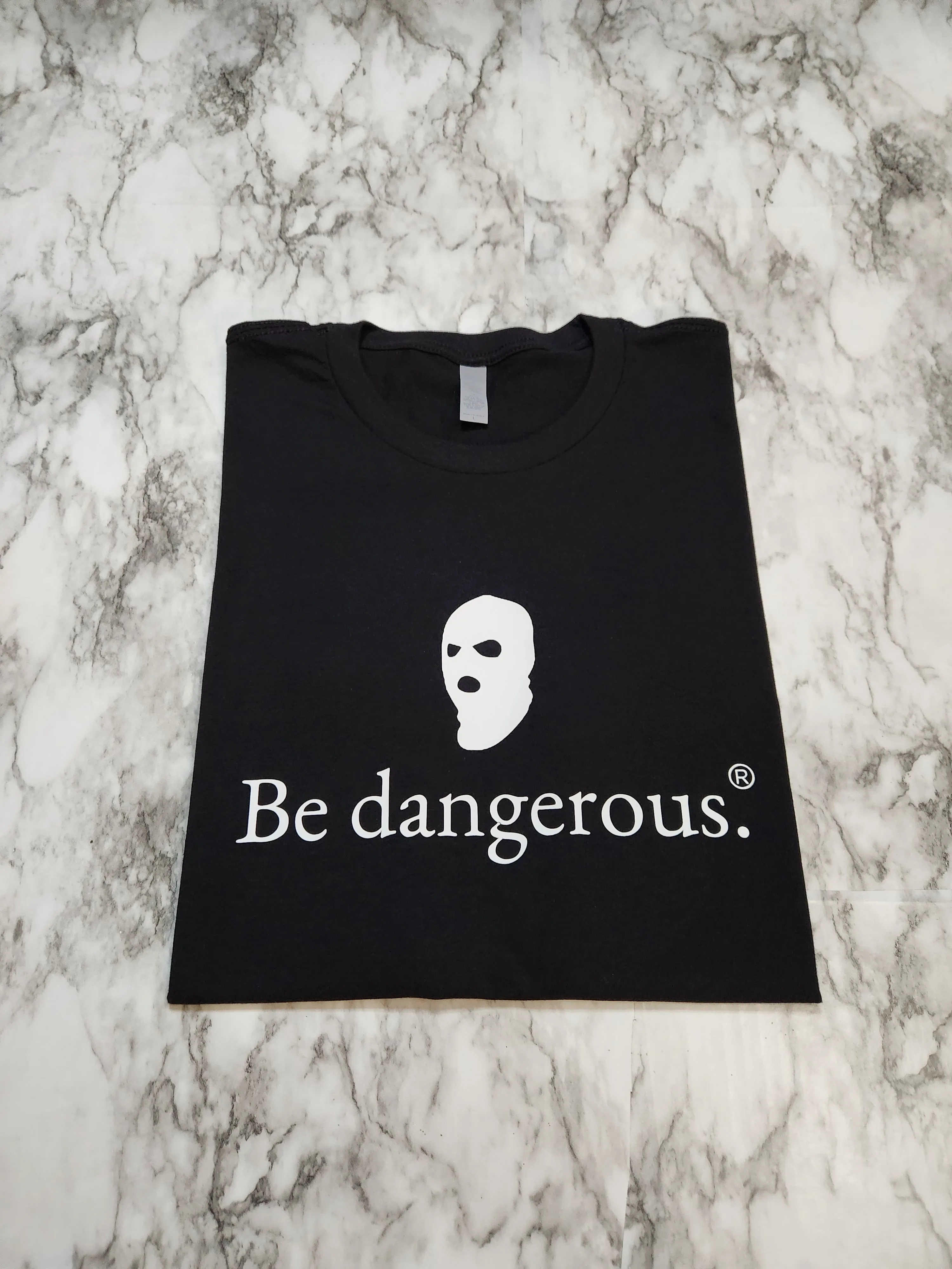 Be dangerous. T-Shirt