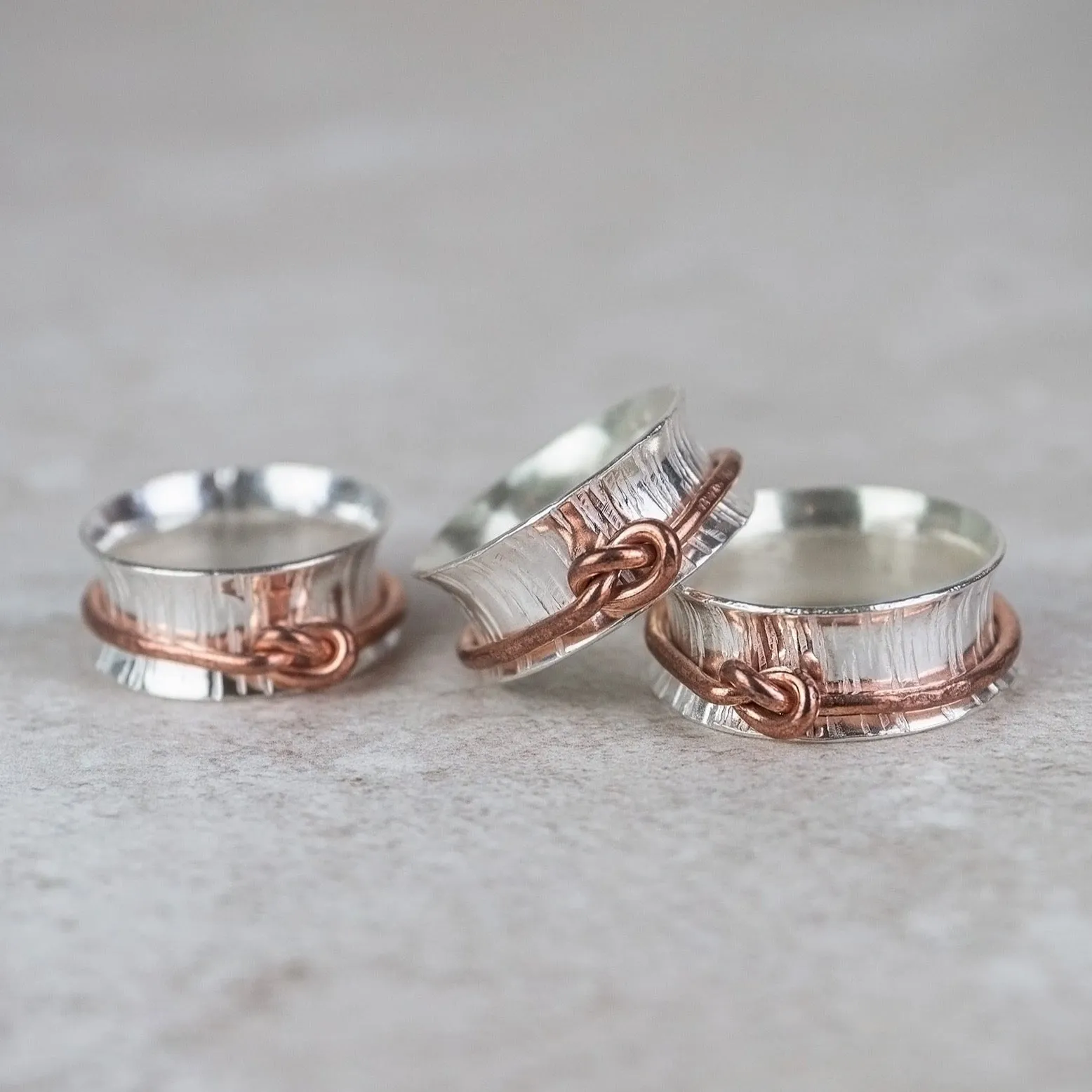 Sterling Silver and Copper Love Knot Spinner Rings
